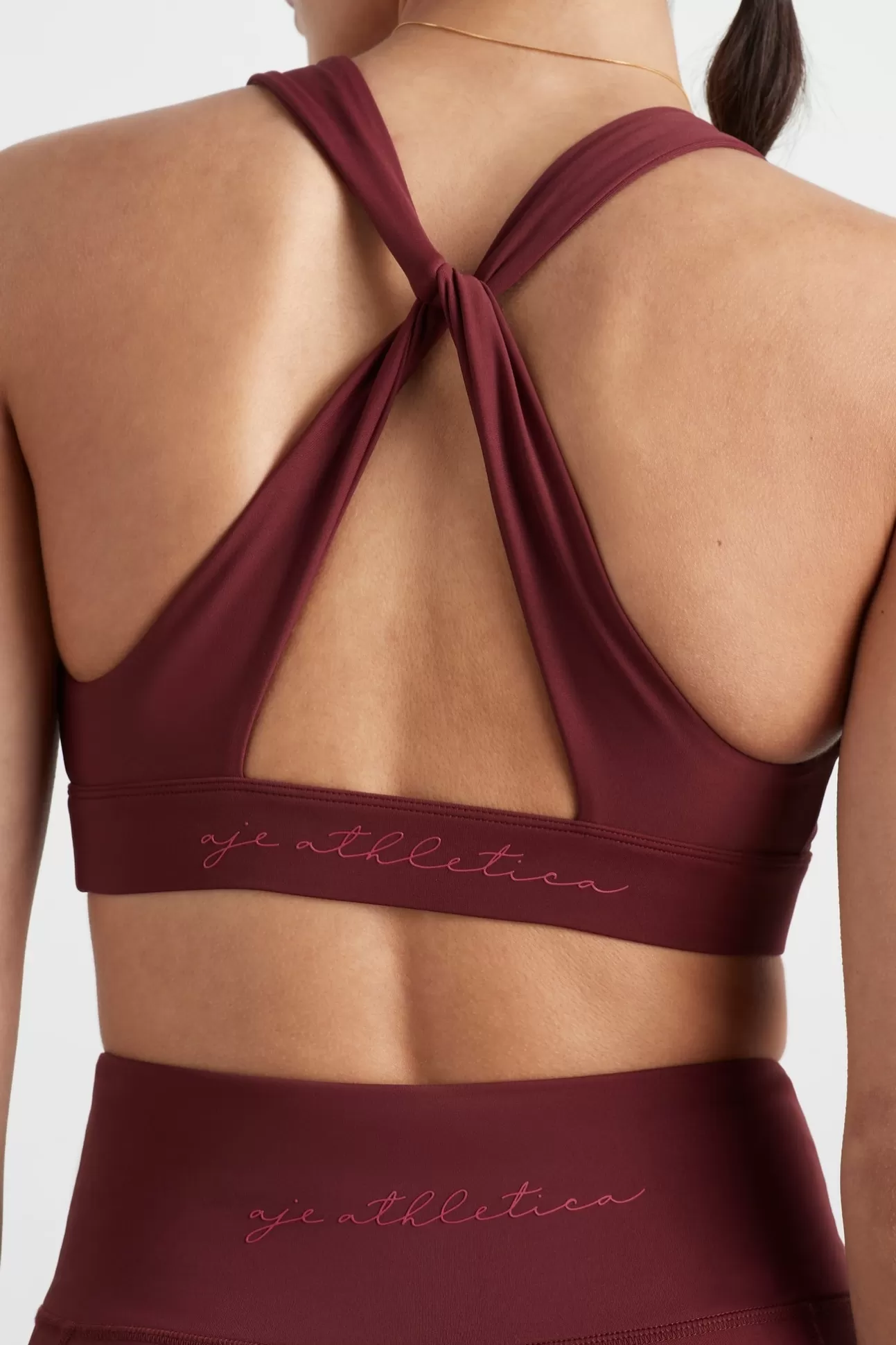 Aje ATHLETICA Twist Back Sports Bra 335 Burnt Burgundy/Berry Best